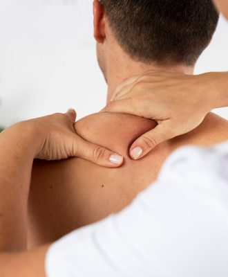 physiotherapist-performing-therapeutic-massage-male-client_23-2149143840